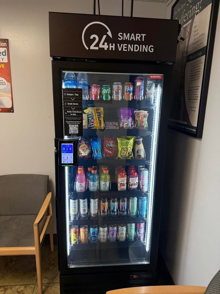 Smart vending machine in a waiting area with snacks and beverages